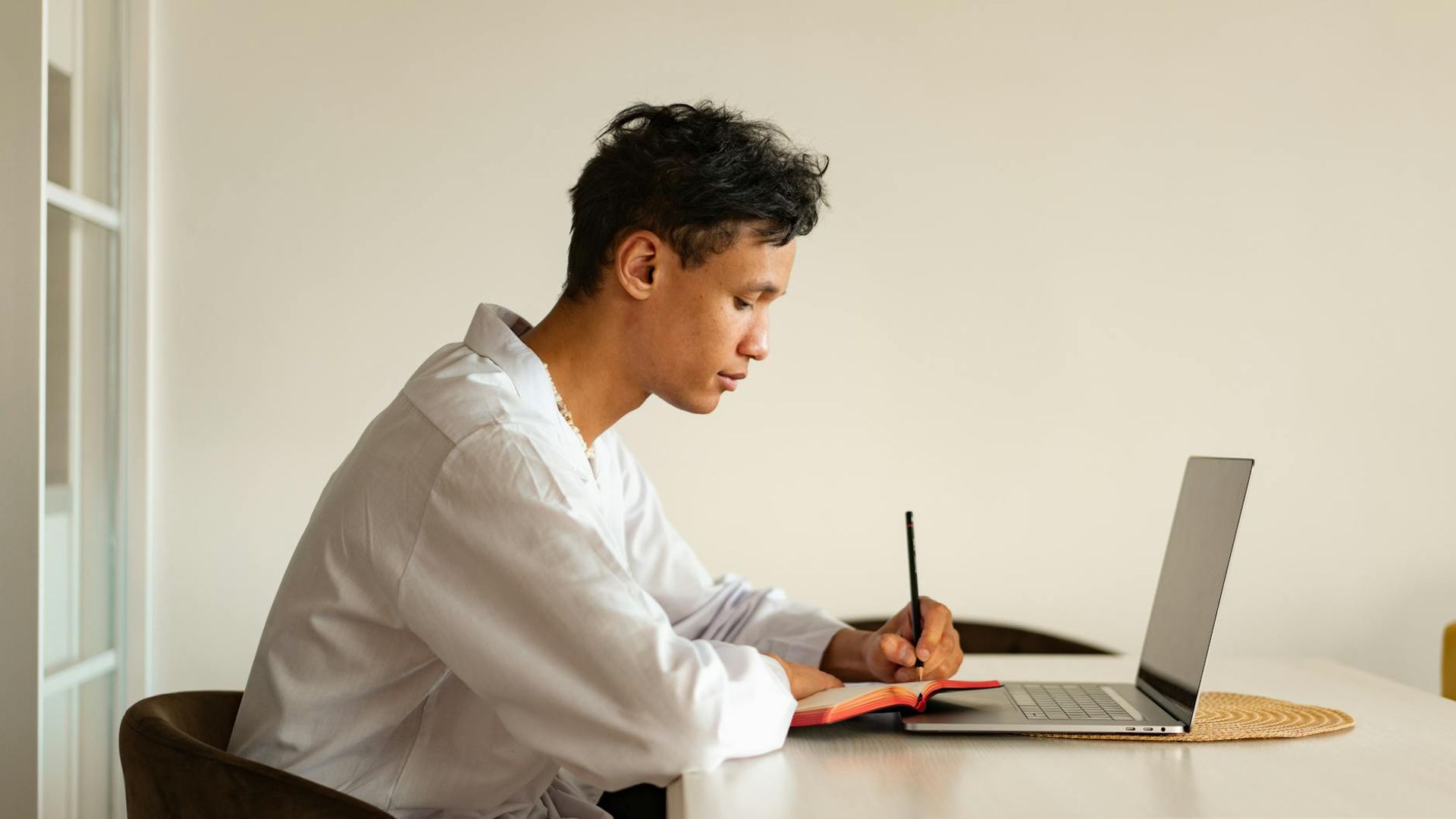 Person looking into the distance in a bright minimalist room.